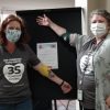 Two people celebrate giving blood at a donation drive